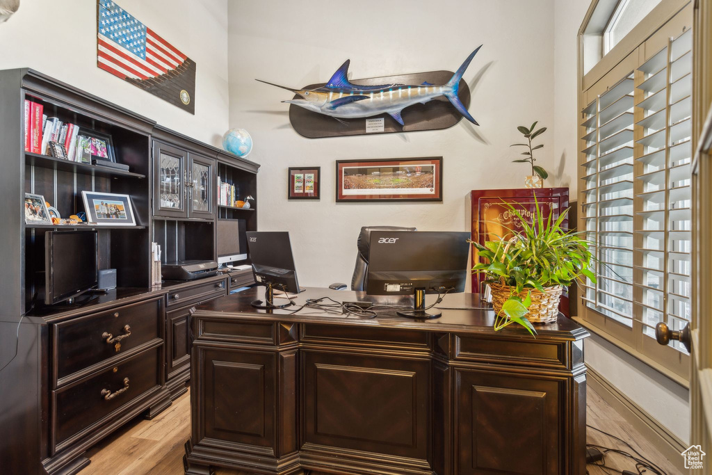 Office area with light wood-style flooring
