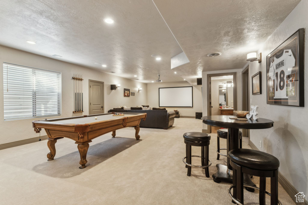 Game room featuring billiards, a textured ceiling, light colored carpet, baseboards, and recessed lighting
