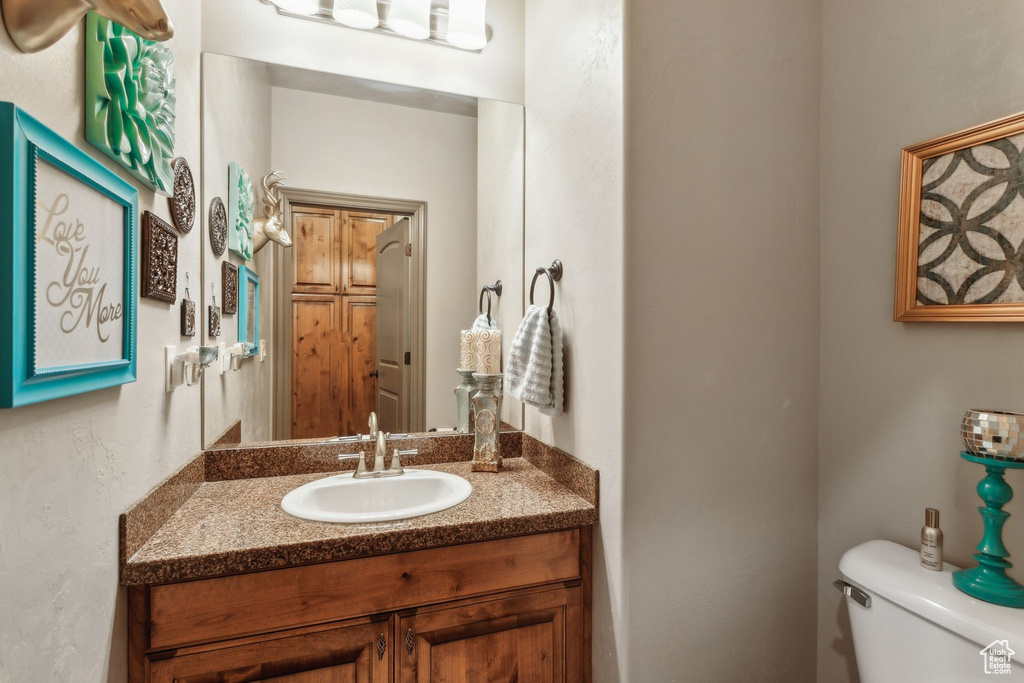 Bathroom featuring toilet and vanity