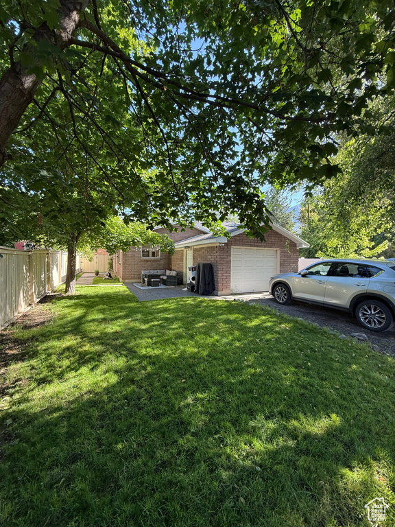 View of yard featuring a garage