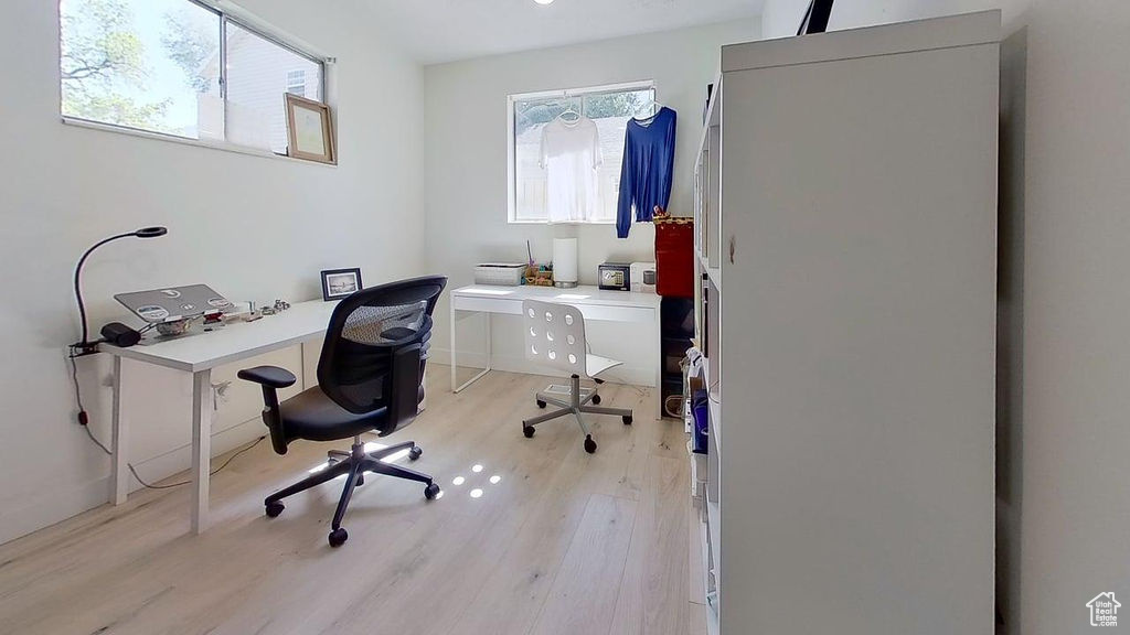 Office area with light wood-type flooring