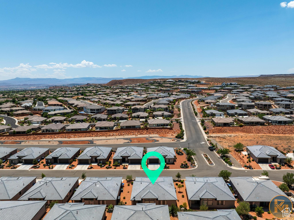 Aerial view of residential area featuring mountains