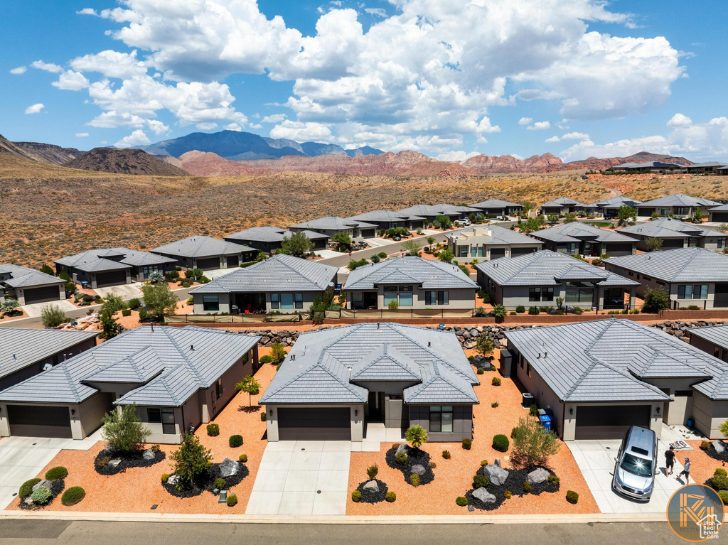 Aerial view of residential area with a mountainous background