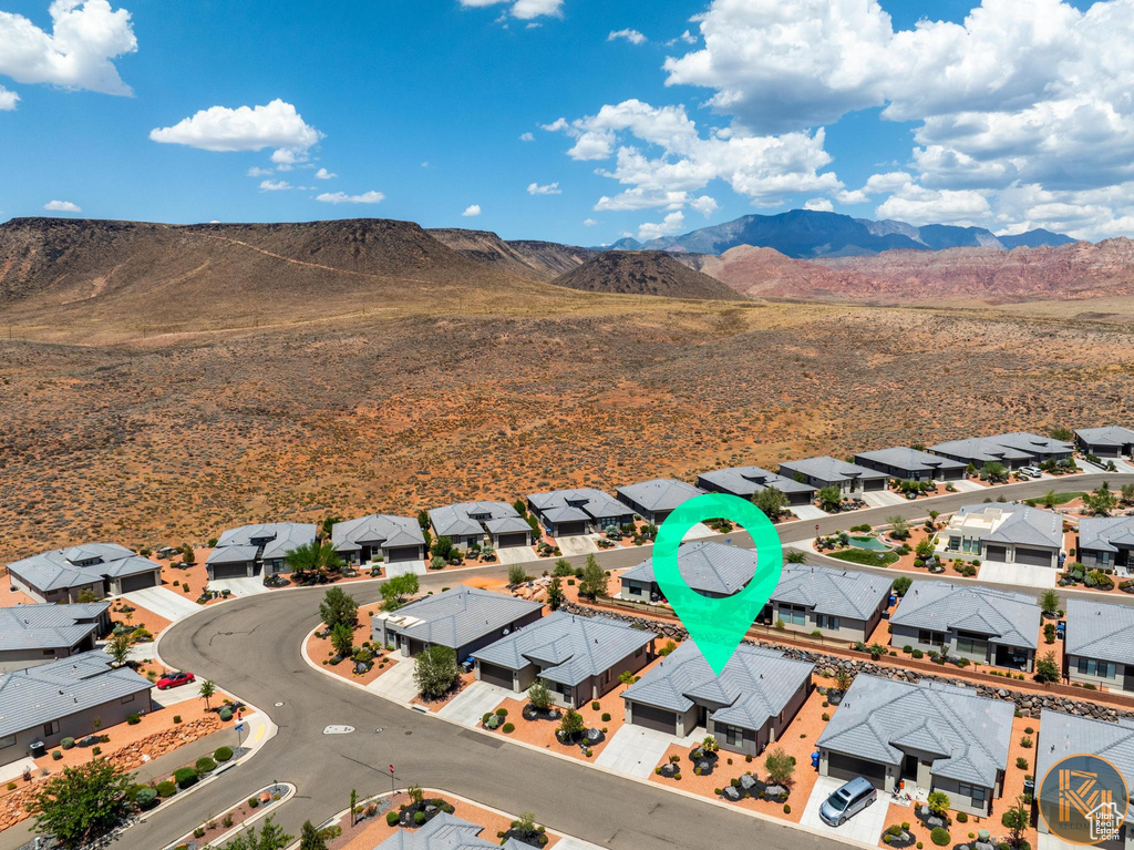 Aerial view of residential area featuring a mountain backdrop