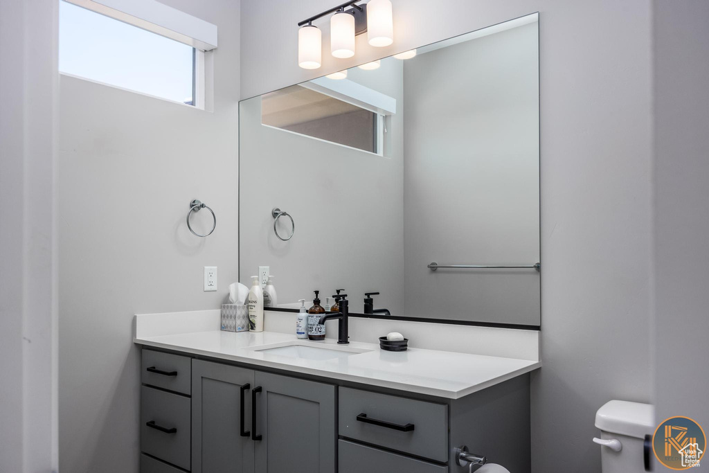 Bathroom with vanity and toilet