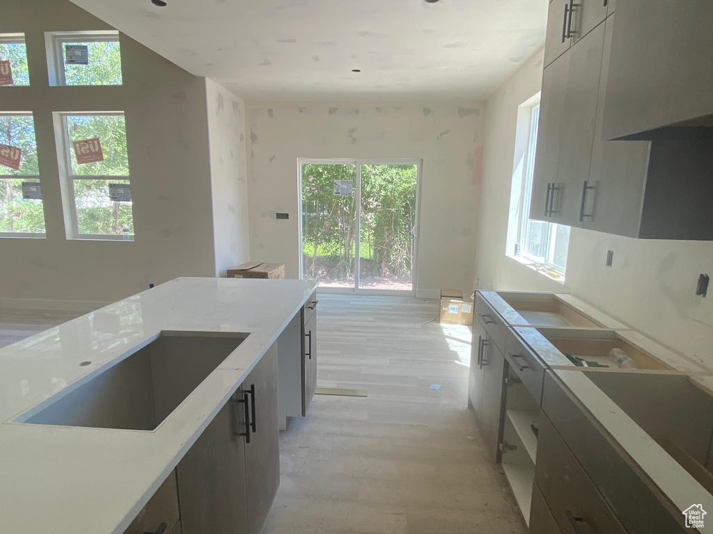 Kitchen with light wood-style flooring