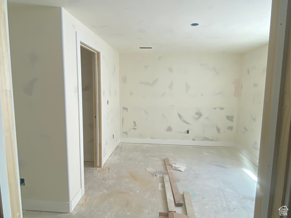 Empty room featuring baseboards