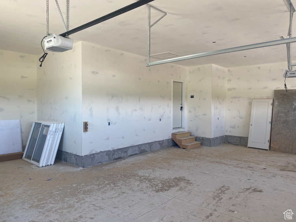Garage featuring a garage door opener