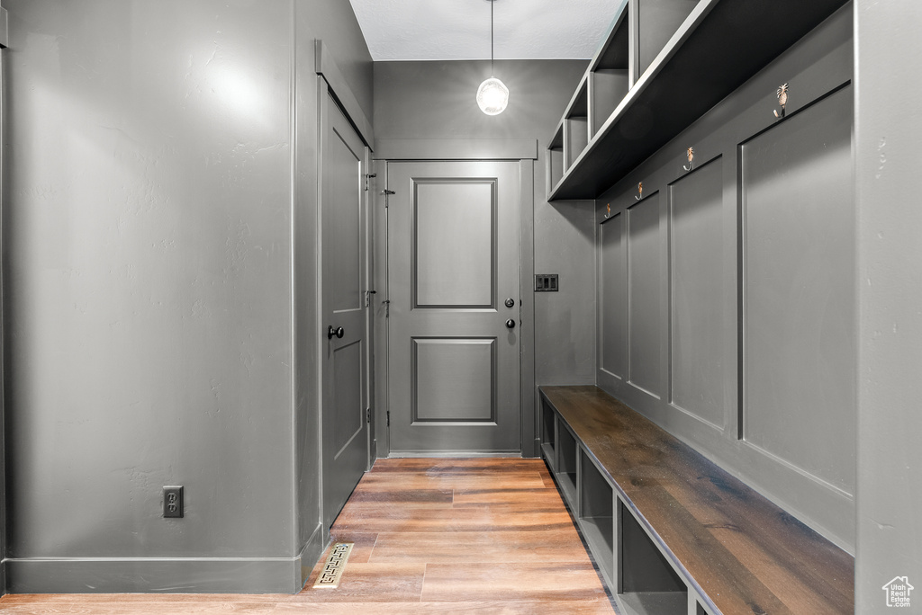 Mudroom featuring light wood-type flooring