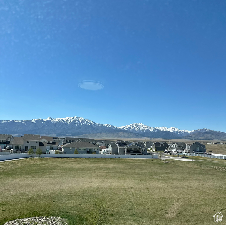 View of mountain backdrop featuring nearby suburban area