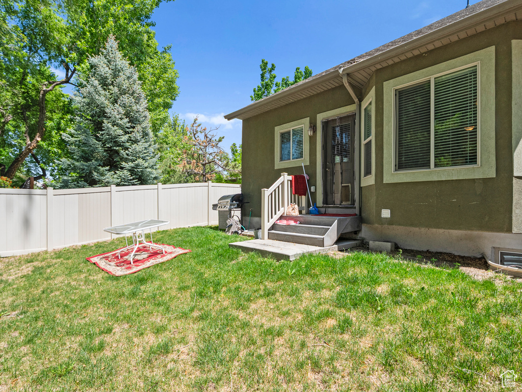 Entrance to property with stucco siding