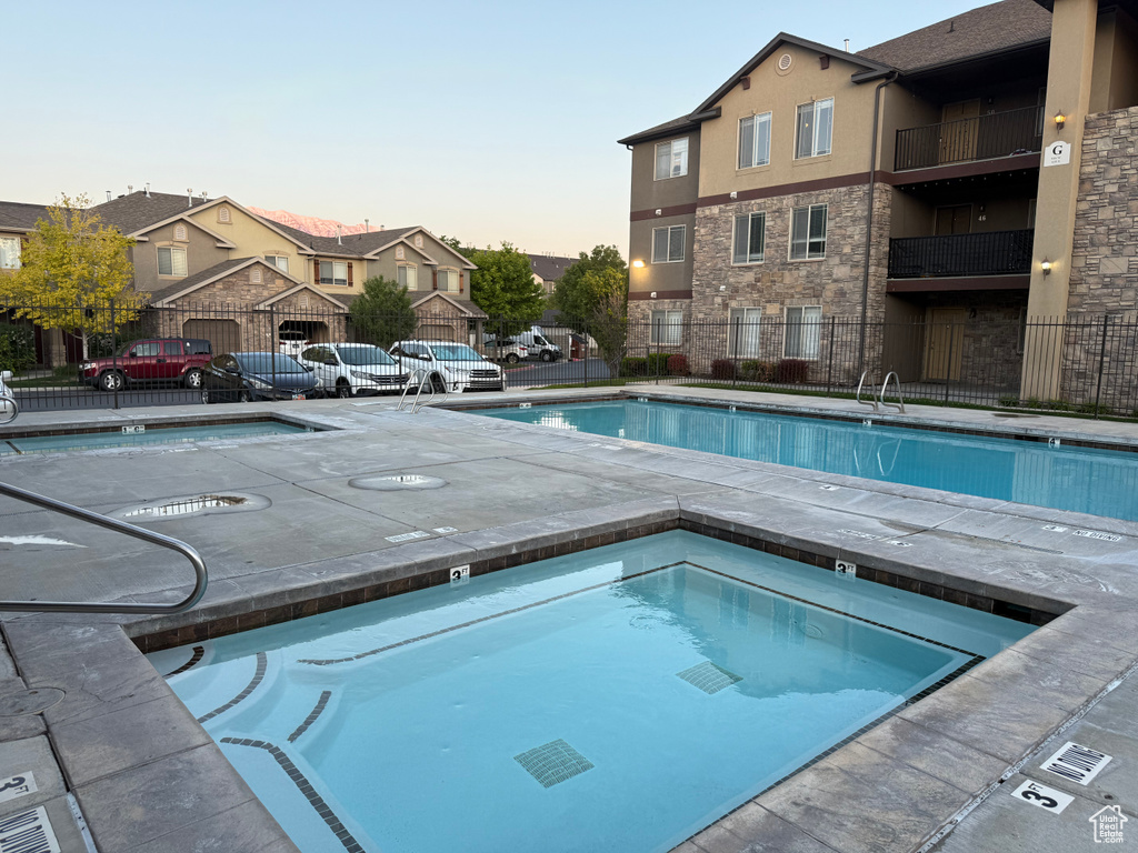 Community pool featuring a community hot tub