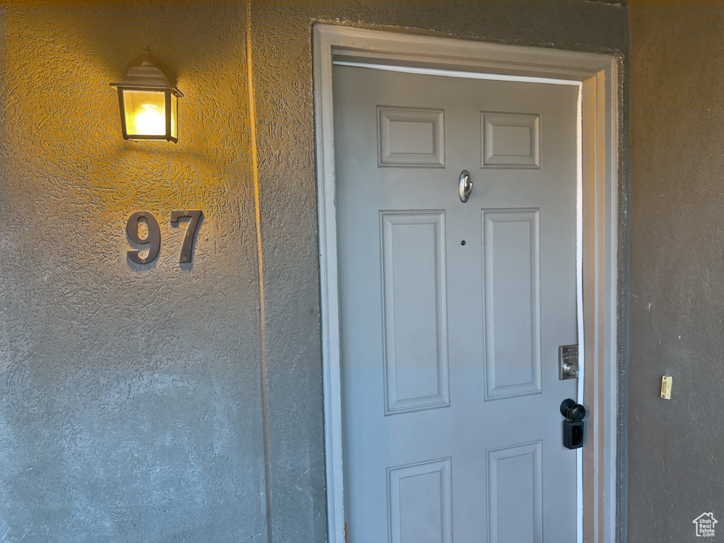 Property entrance with stucco siding