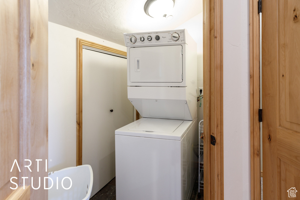 Laundry room with estacked washer and dryer