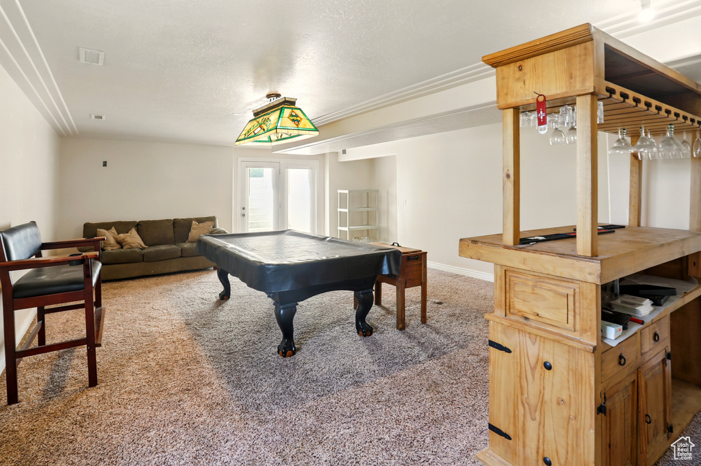 Playroom featuring carpet flooring, billiards table, a bar, and baseboards