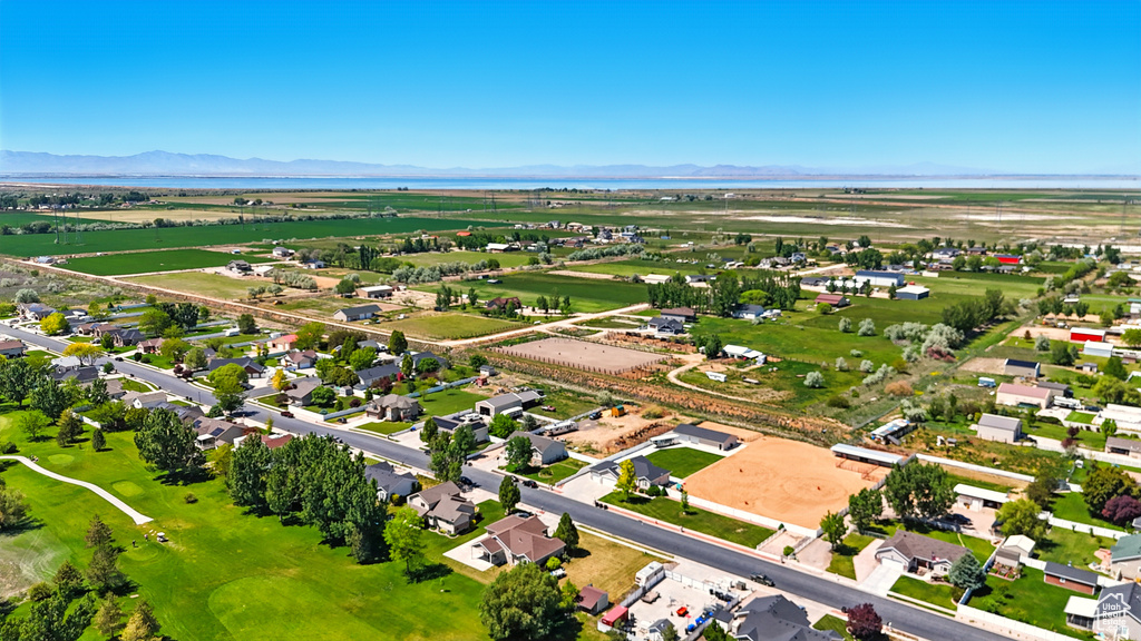 Aerial perspective of suburban area featuring a mountain backdrop