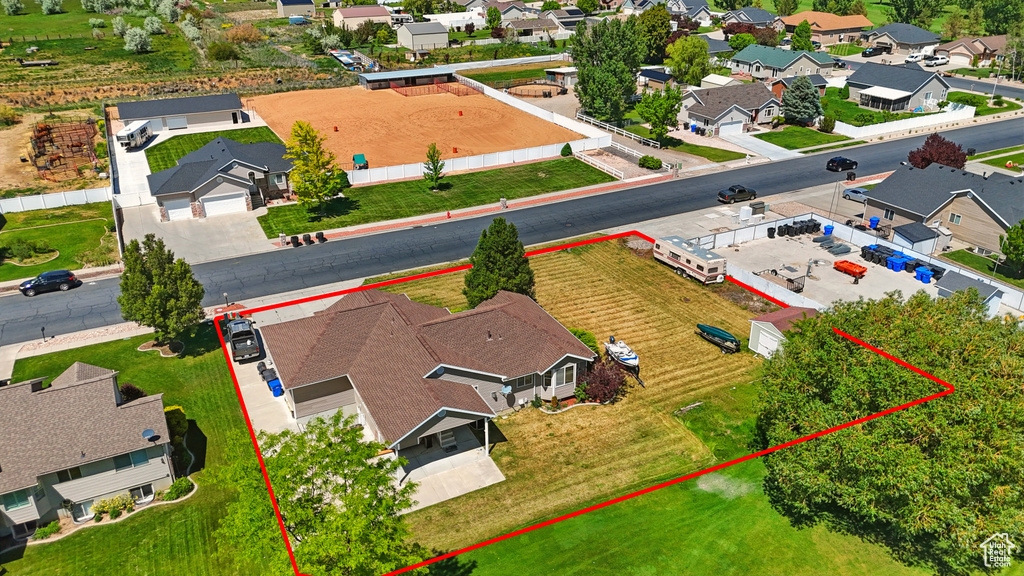 Aerial perspective of suburban area featuring property boundaries highlighted