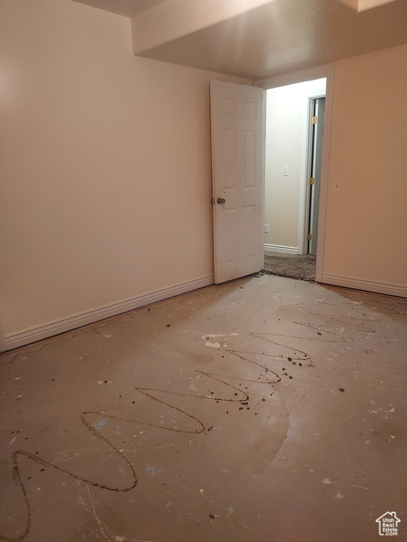 Unfurnished room with baseboards