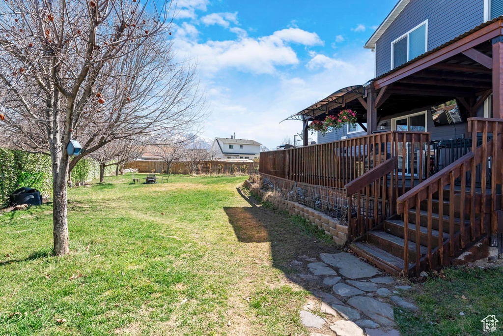 View of yard featuring a wooden deck