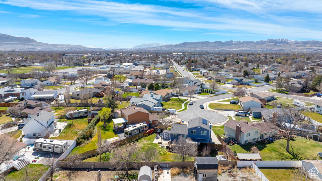Aerial perspective of suburban area with a mountain backdrop