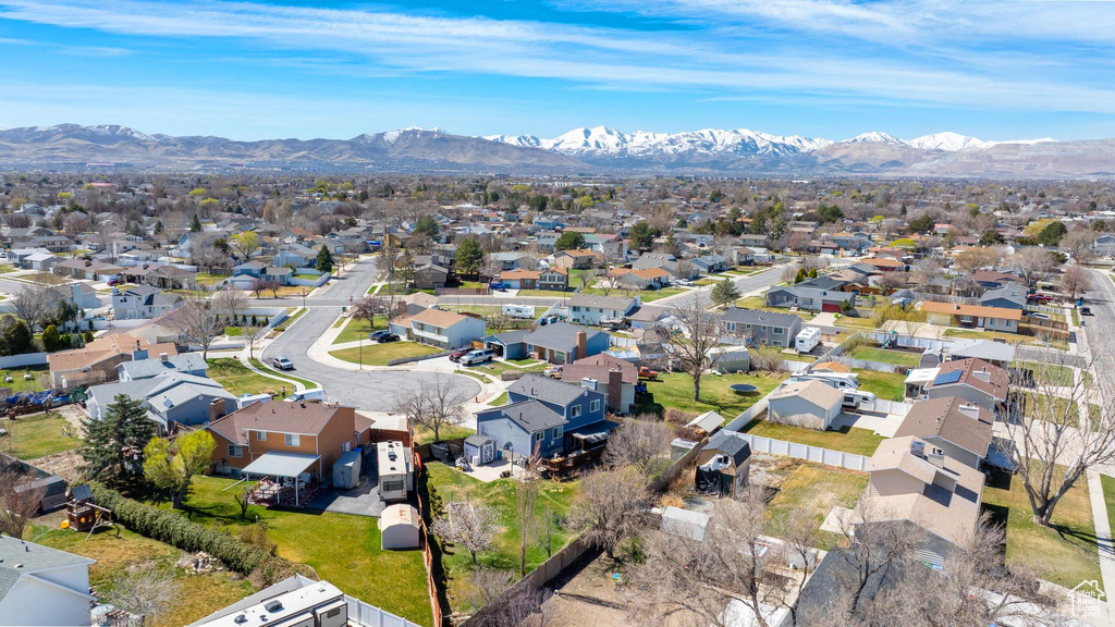 Aerial perspective of suburban area with a mountainous background