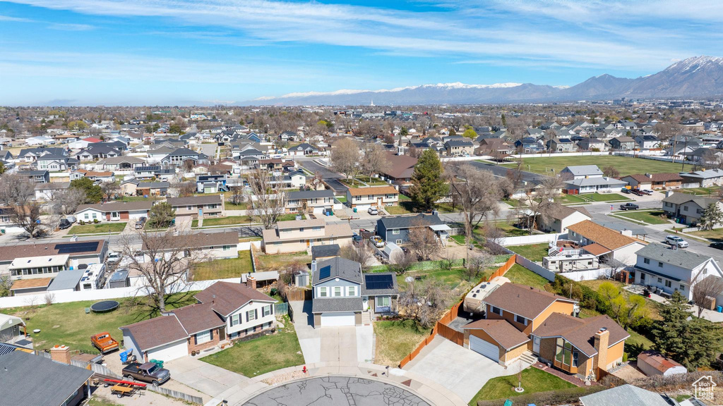 Aerial view of residential area featuring mountains