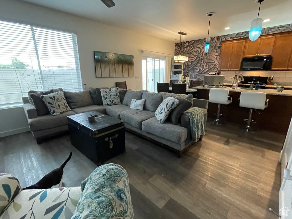 Living room featuring dark wood finished floors and recessed lighting
