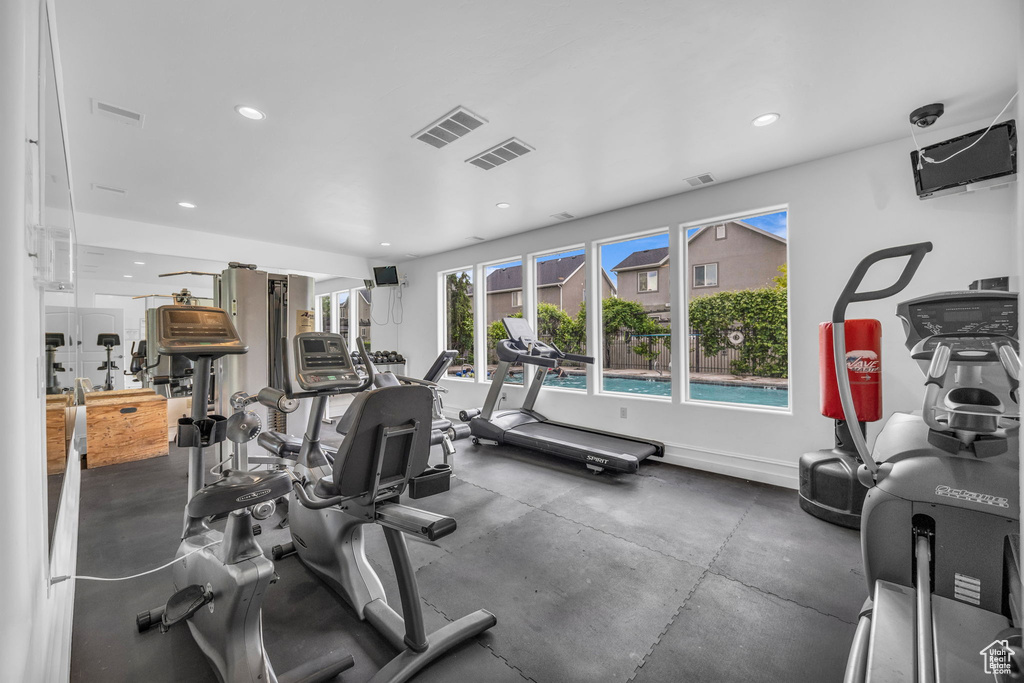 Workout area with recessed lighting and baseboards