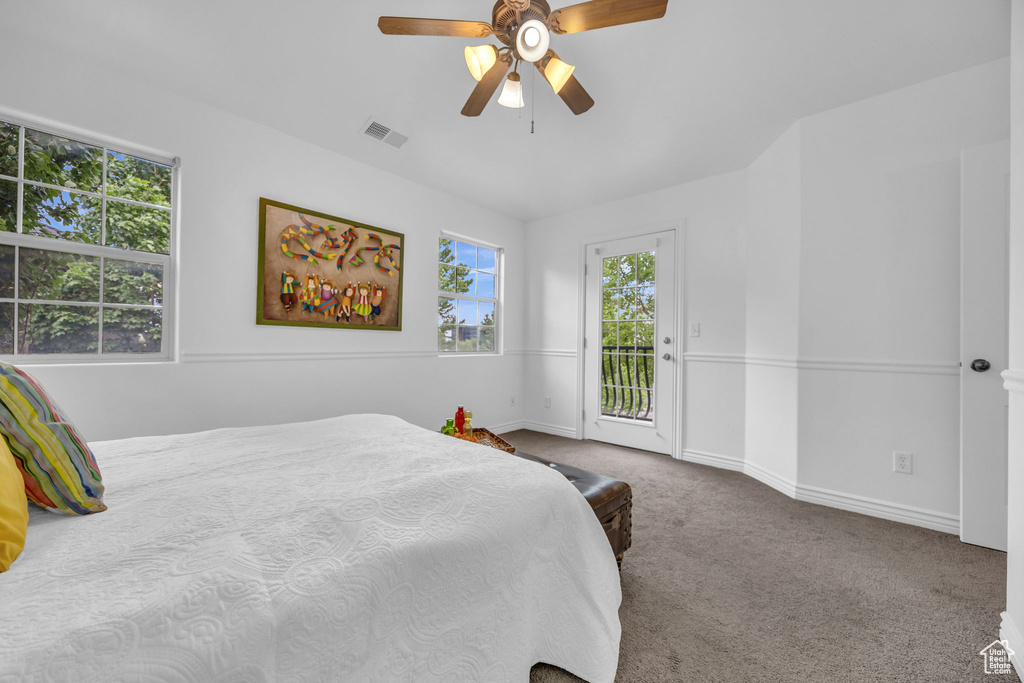 Carpeted bedroom with access to exterior, baseboards, and ceiling fan