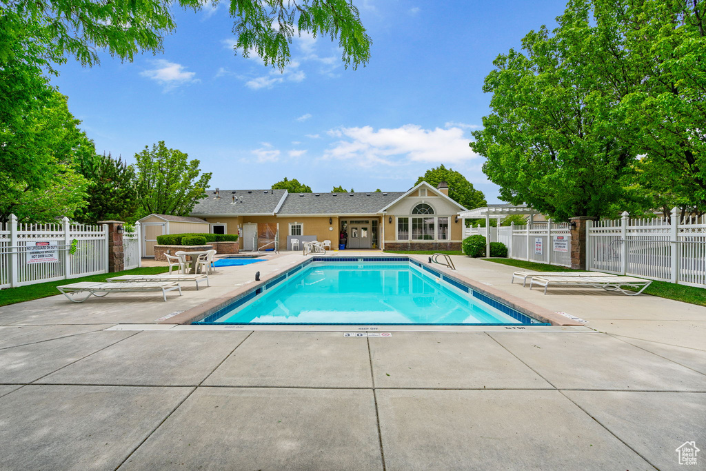 Community pool featuring a patio area