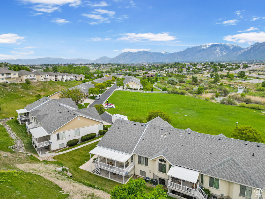 Aerial perspective of suburban area with a mountain backdrop