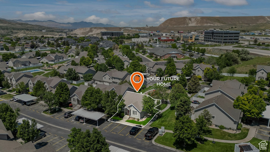 View of property location with a mountainous background and nearby suburban area