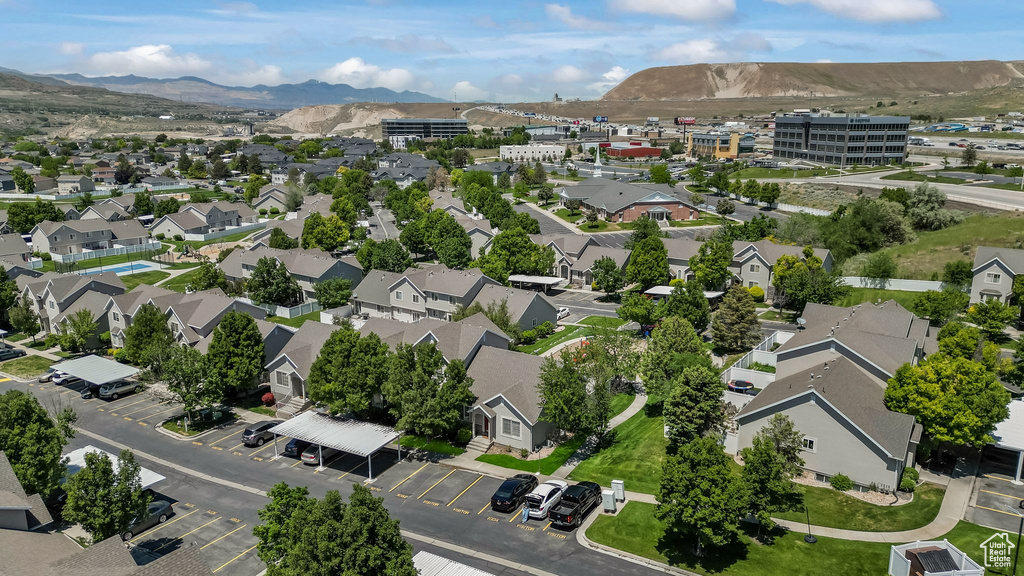 Aerial perspective of suburban area featuring a mountainous background