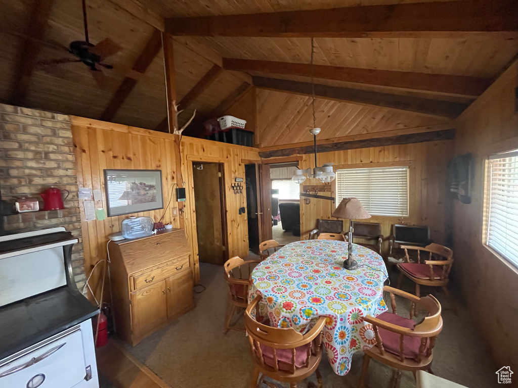Dining area with wood walls and wood ceiling