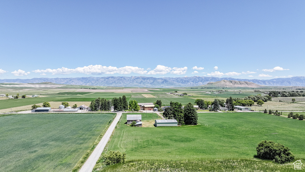 View of mountain backdrop with rural landscape