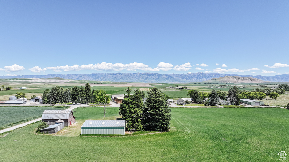 View of mountain backdrop featuring rural landscape