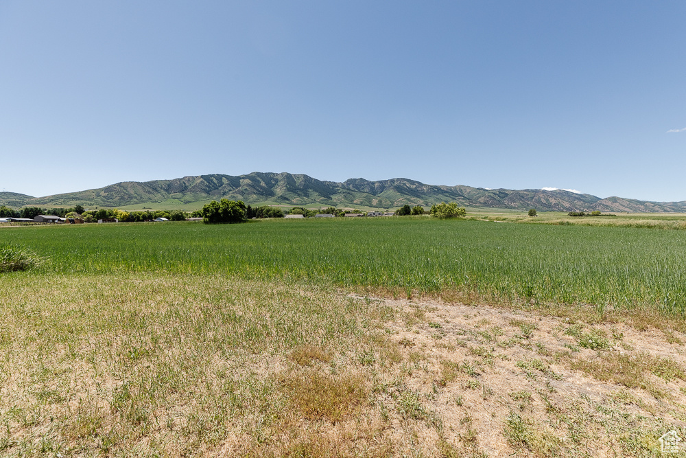 View of mountain backdrop featuring rural landscape