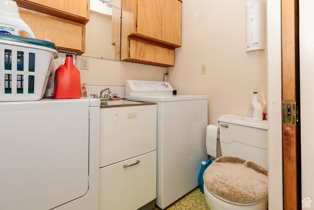 Laundry room featuring washer and clothes dryer