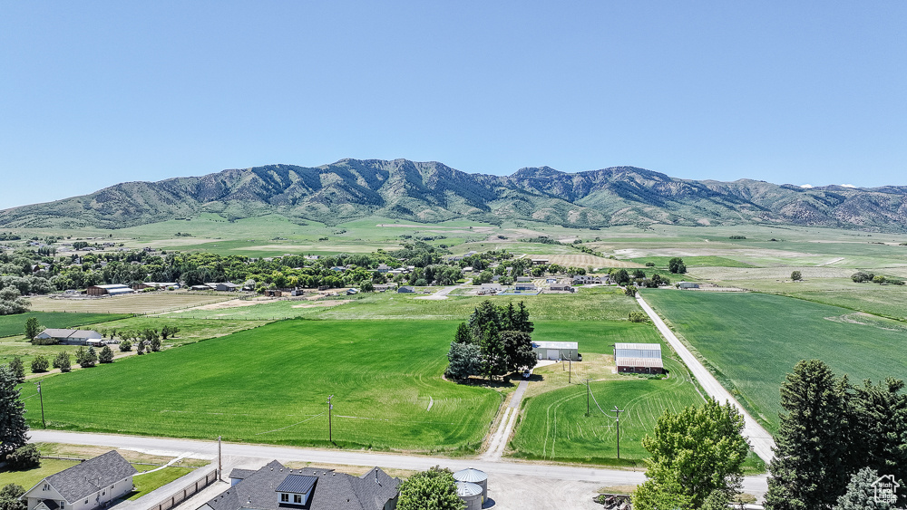 View of mountain backdrop with rural landscape