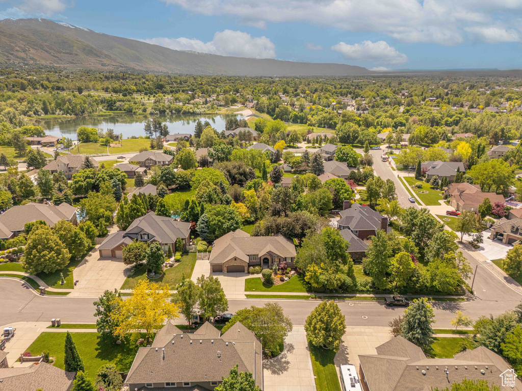 Aerial perspective of suburban area with a water and mountain view