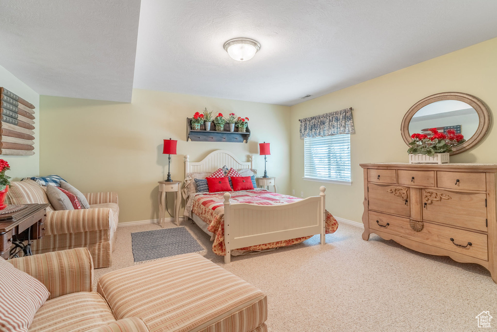 Carpeted bedroom with baseboards