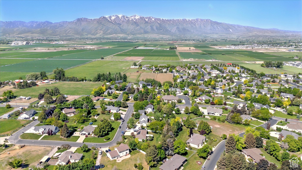 Aerial view of property and surrounding area with mountains