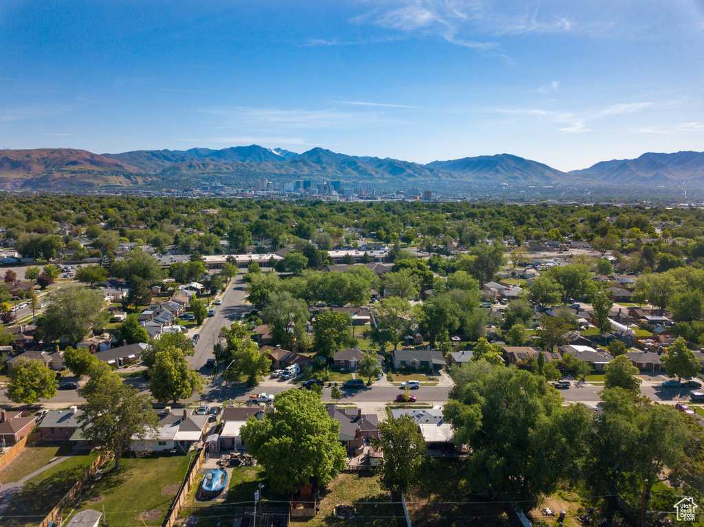 Aerial perspective of suburban area with a mountain backdrop