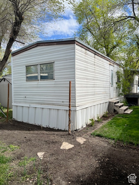 View of side of home with entry steps