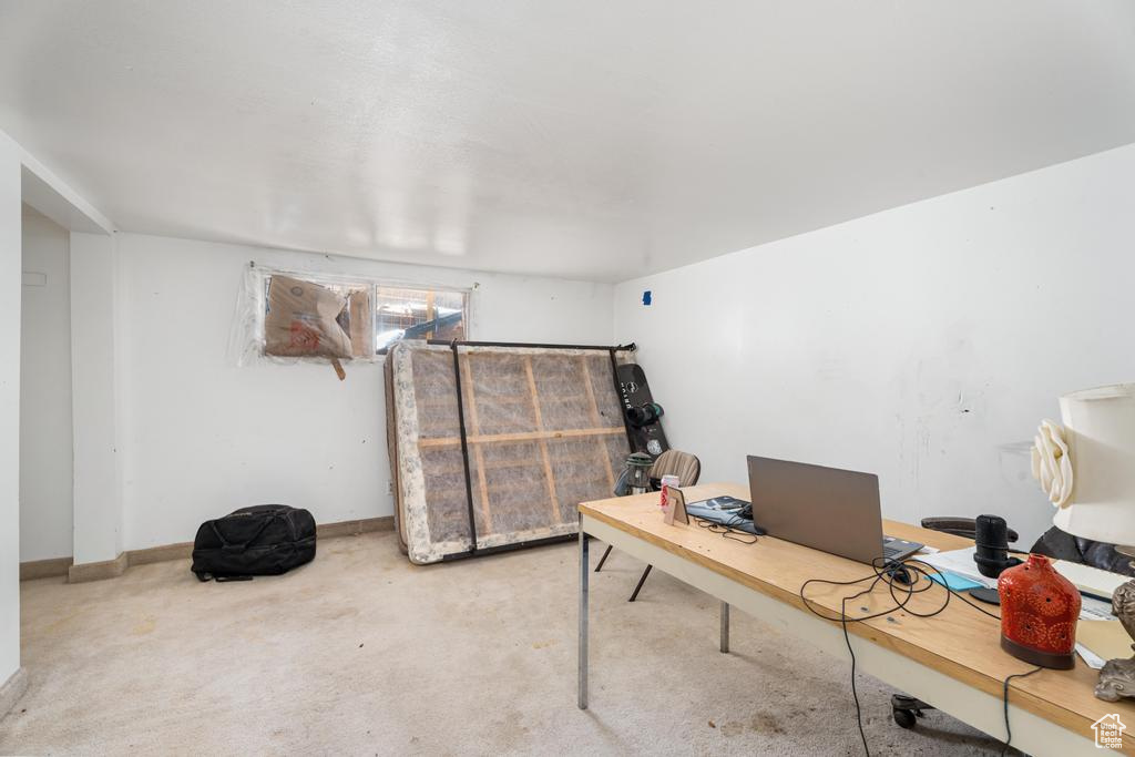 Office space with carpet and baseboards