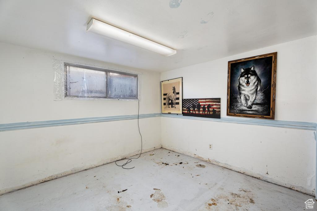 Spare room with unfinished concrete floors