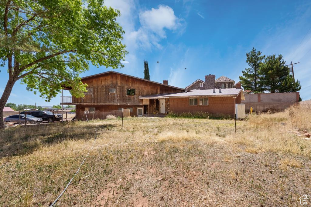 Rear view of house with a chimney