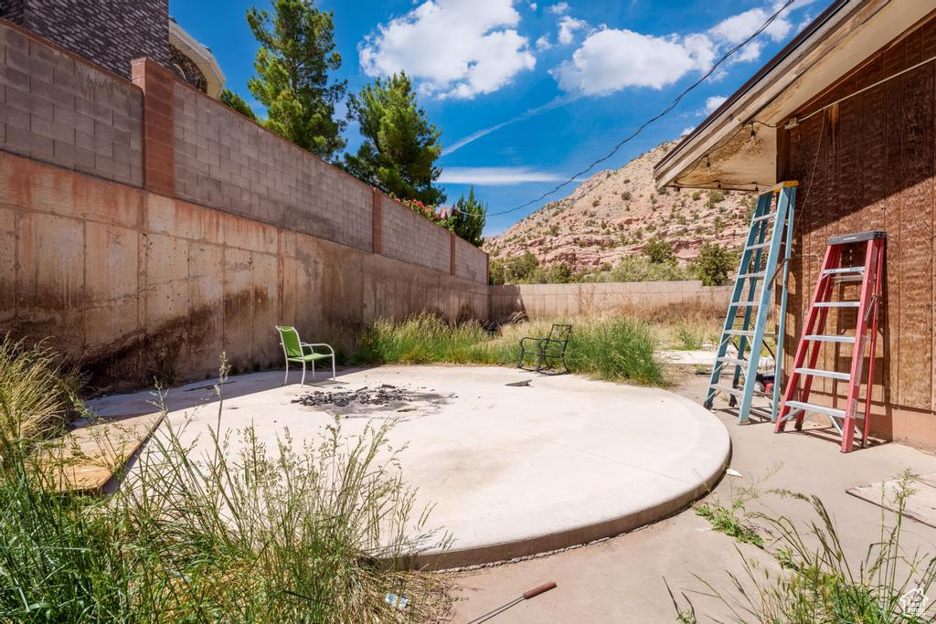 Fenced backyard with a patio area