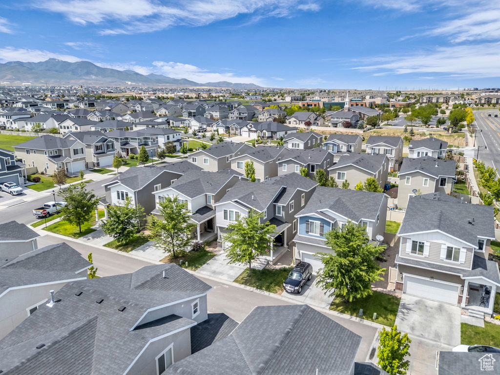 Aerial view of residential area featuring a mountainous background
