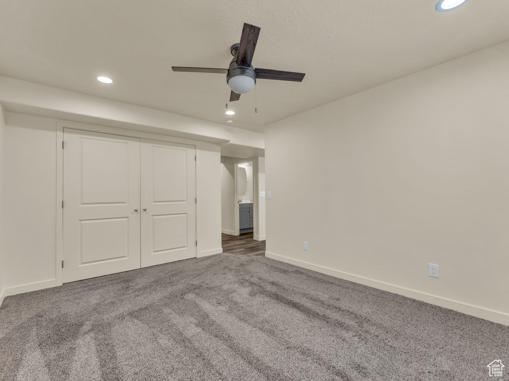 Unfurnished bedroom featuring recessed lighting, carpet flooring, baseboards, ceiling fan, and a closet